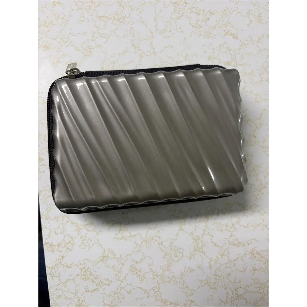 TUMI For Delta Silver Gray Hard Shell Cosmetic Toiletries Zip Travel Case